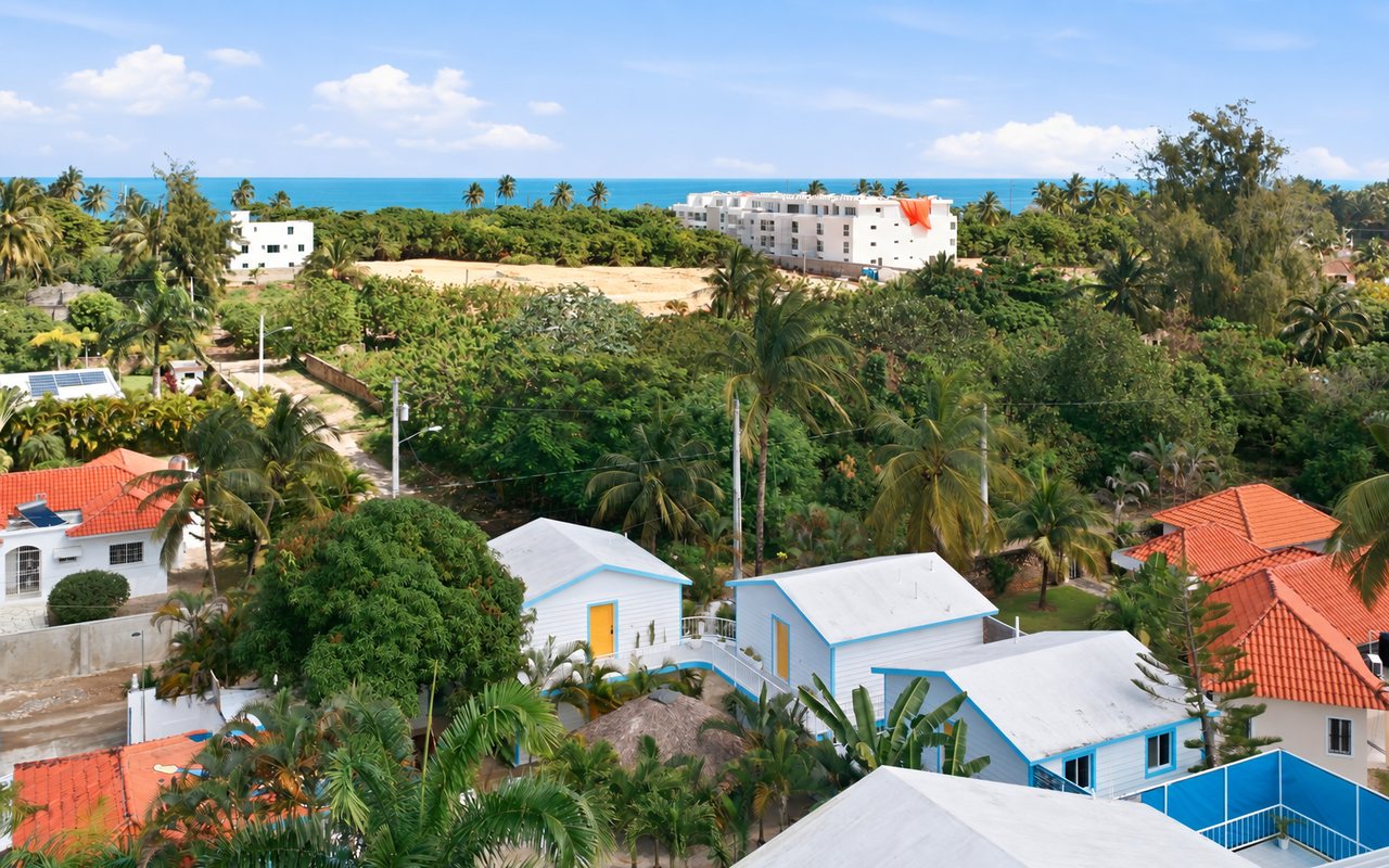 Aerial view of both properties with the ocean behind